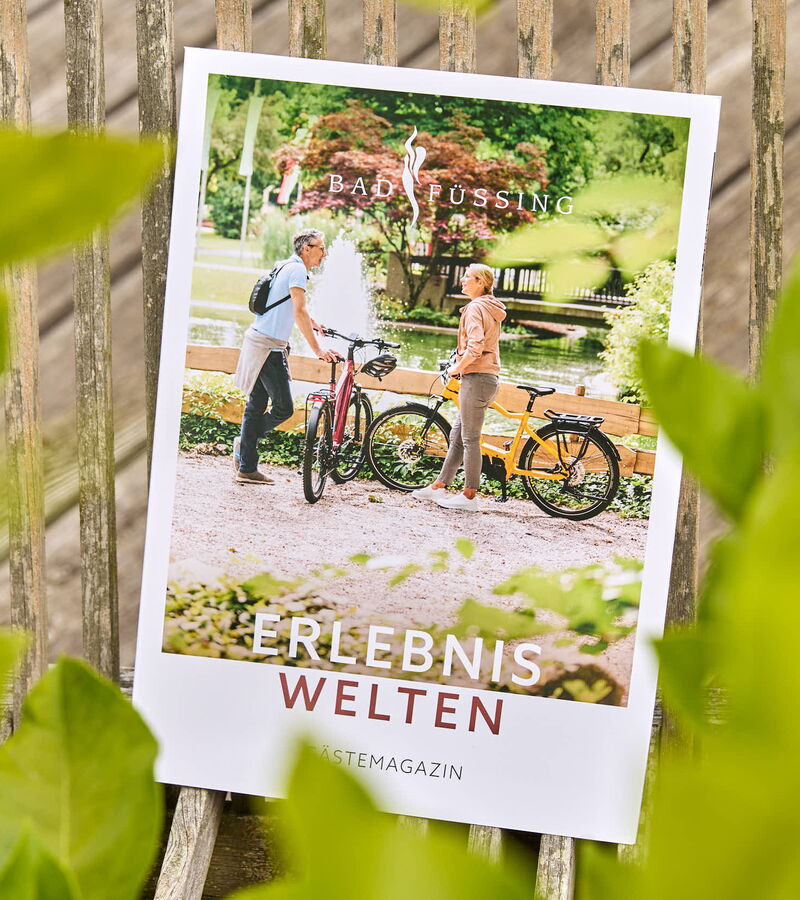 Grafikdesign von Werbung am Inn für das Gästejournal Erlebniswelten des Kur- & GästeService Bad Füssing